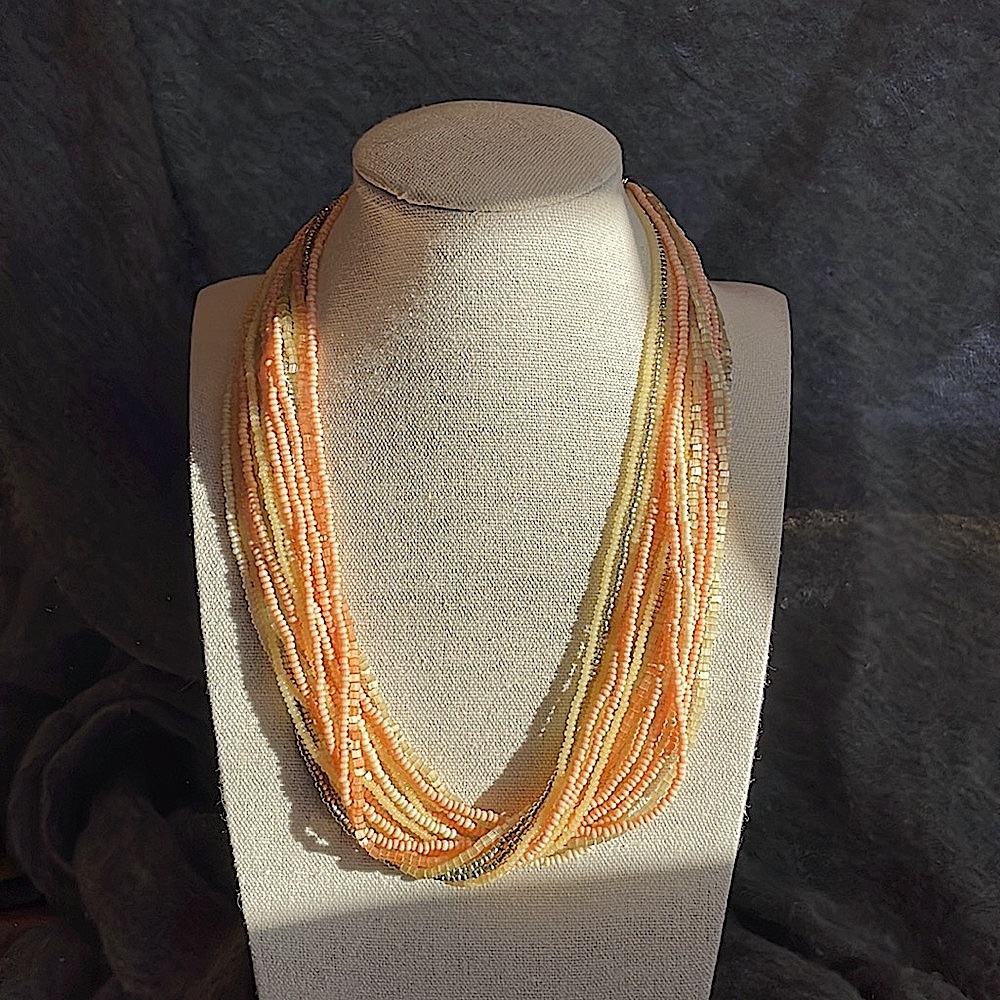 Gorgeous multi strand seed bead necklace in peach, lime, yellow, & silver.